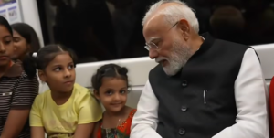 PM Narendra Modi chats with children during his travel to SRCC in a Delhi Metro train on September 5.
